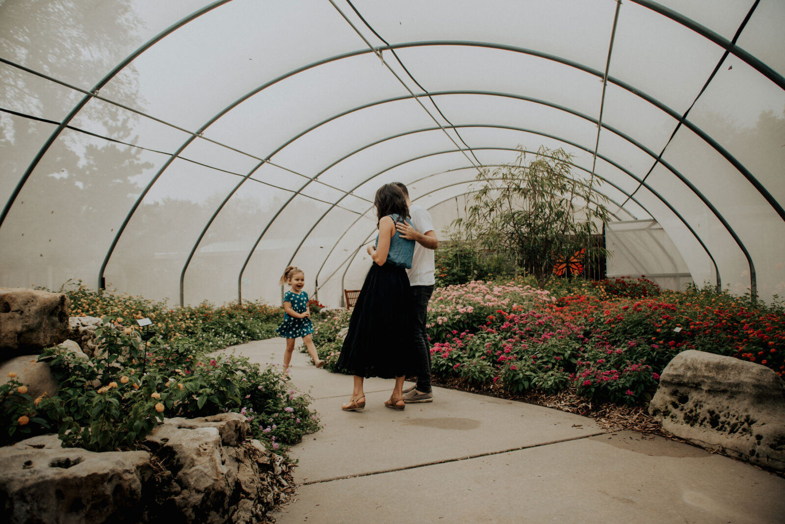 A family in the butterfly garden at botanica gardens