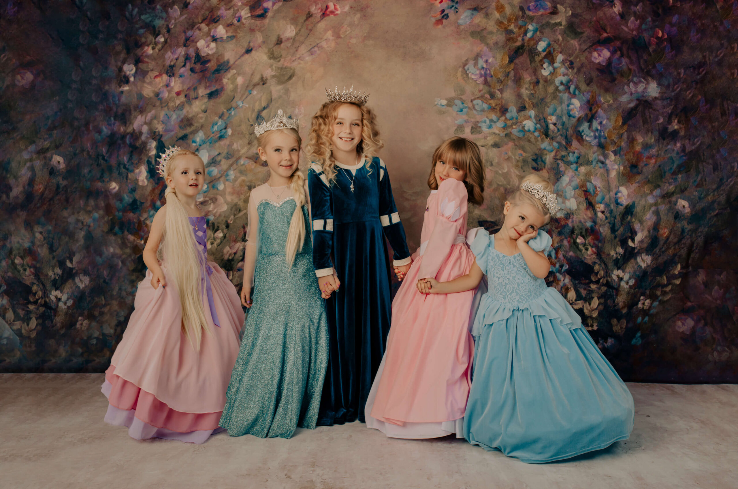 Little girls dressed up as Rapunzel, Elsa, Merida, Ariel, and Snow white for a princess party, by Broom Tree Photo, wichita photographer